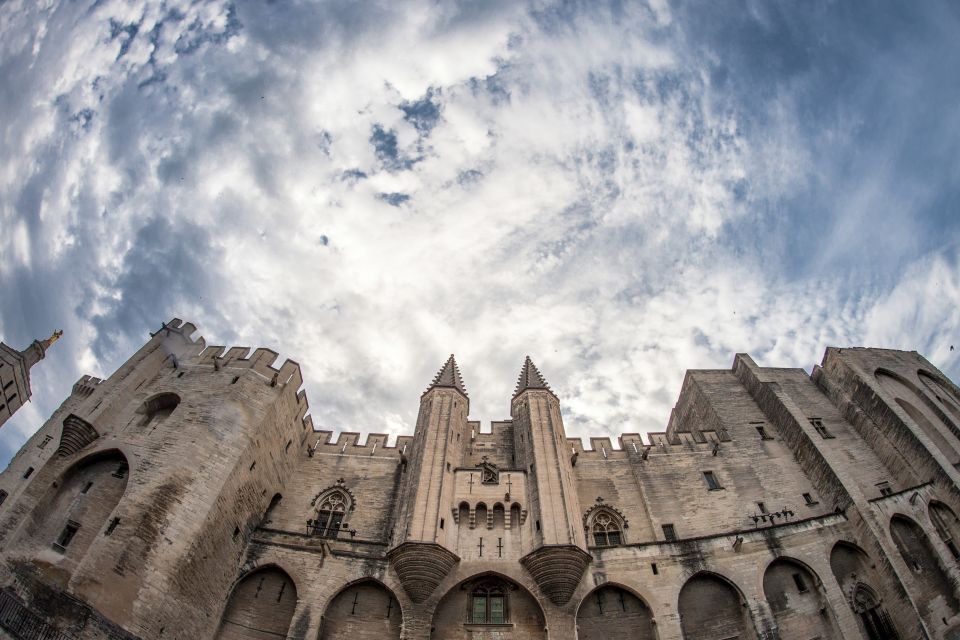 Avignon: City Walking Tour with Popes Palace Entry - Place de l’Horloge and the painted-window details you’d miss alone