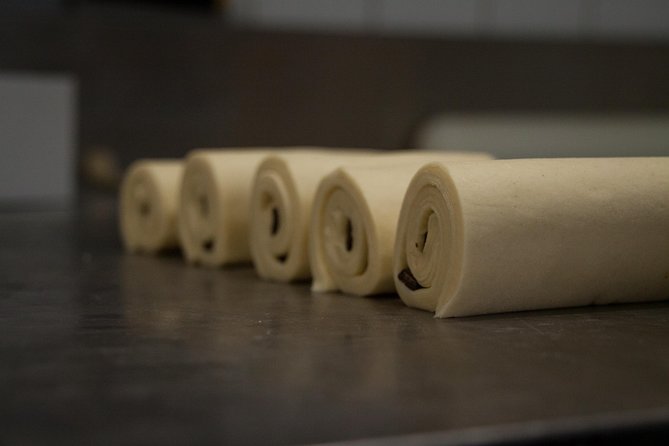 Behind the Scenes of a Boulangerie: French Bakery Tour in Paris - Baguette rules and shaping tips: what makes Paris bread different