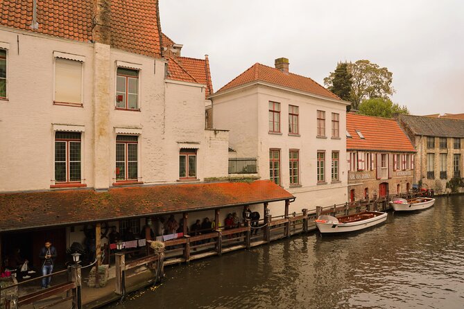 Bruges Guided Day Trip with Canal Cruise Option and Hotel Pickup - Markt, fries, waffles, and a useful break