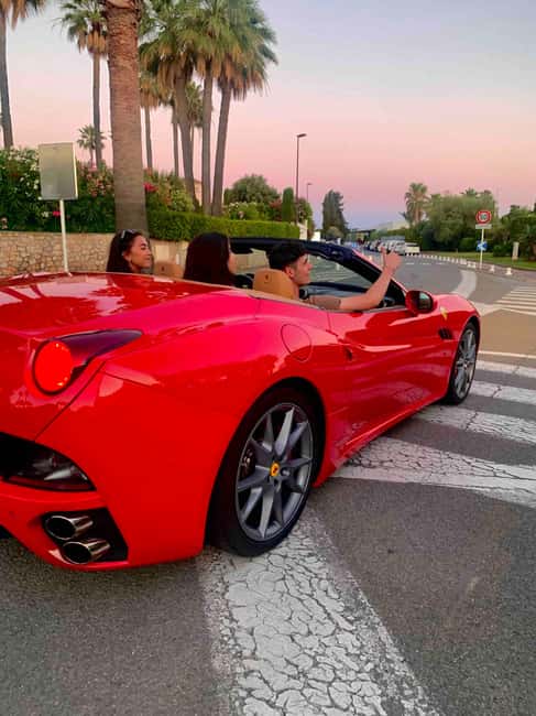 Cannes:private Ferrari Big Tour to Juan Les Pins and Antibes - Juan-les-Pins and the turn toward Cap d’Antibes