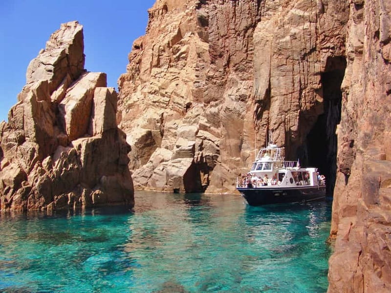 Cargèse: Calanques of Piana on a family boat - Croisières Grand Bleu ride: the Omigna Genovese Tower and early views