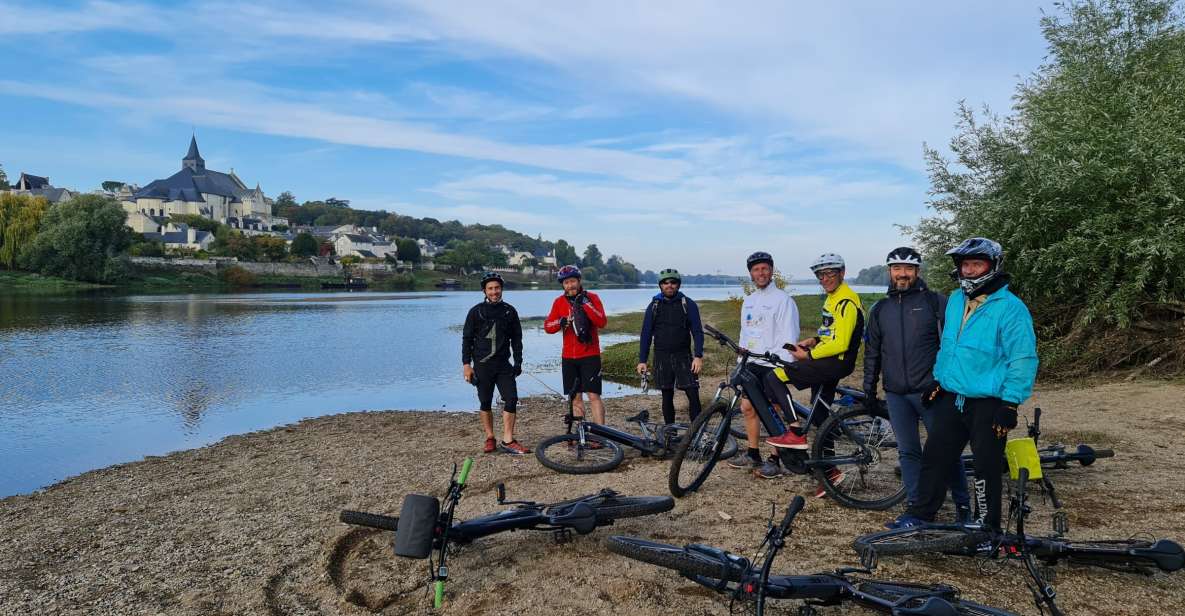 Chinon: Bicycle Tour of Saumur Wineries with Picnic Lunch - Vintage bikes beneath Bouvet Ladubay