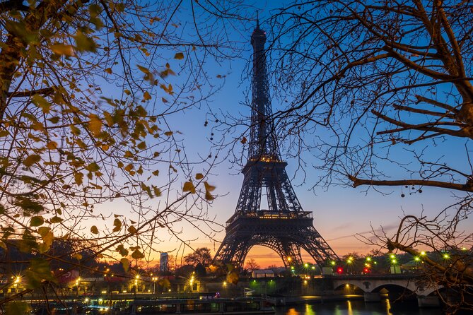 Eiffel Tower Guided Tour by Stairs with Optional Summit by Lift - First-floor details: spiral staircase and the glass-floor moment