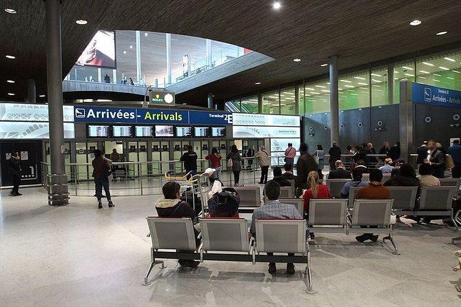 From Paris to CDG airport or From CDG airport to Paris (one way) - Meeting Your Chauffeur at CDG Arrivals Gate (With a Name Board)