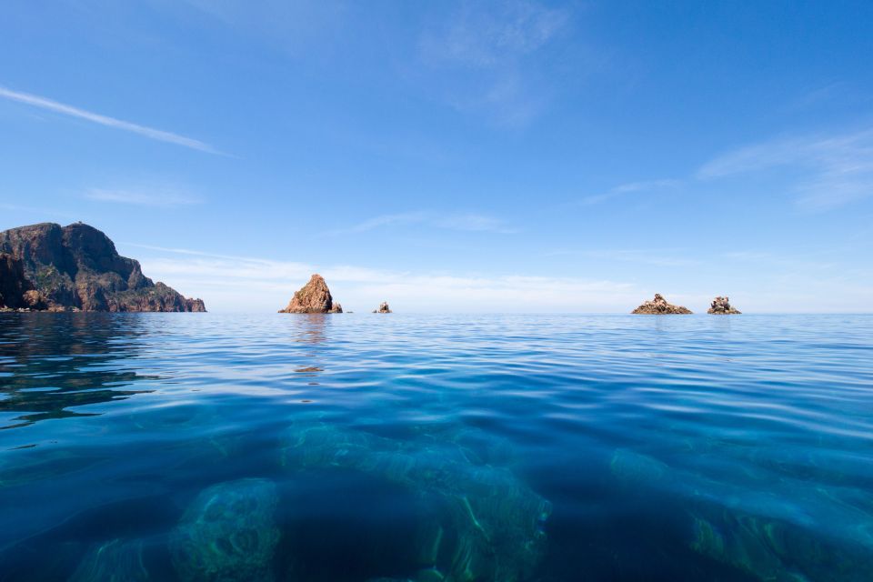 From Porto: Boat tour to the Calanches of Piana & Capo Rosso - Capo Rosso: natural arch views and the Genoese tower angle