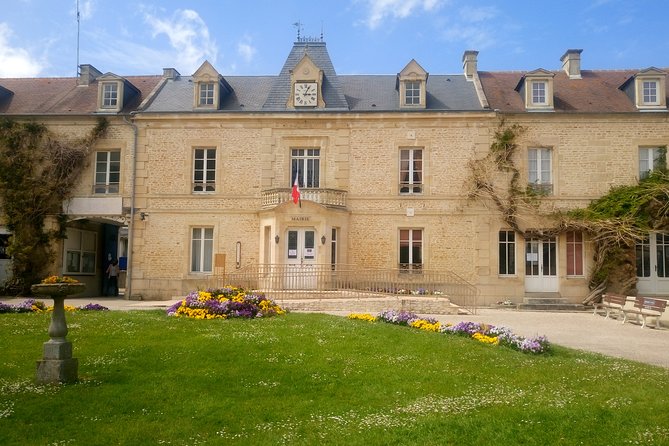 Guided Tour in an Old Convertible Car on the Côte de Nacre - Stop 6: Lion-sur-Mer with town hall streets and a castle approach