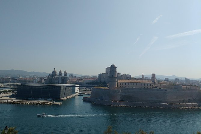 Guided Tour in Marseille: Vieux Port & Old City - What the walk feels like: moderate fitness, stairs, and no headsets in small groups