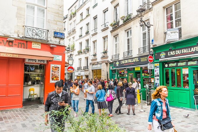 Le Marais Paris Private Transfers - Rue des Rosiers brings the neighborhood to life