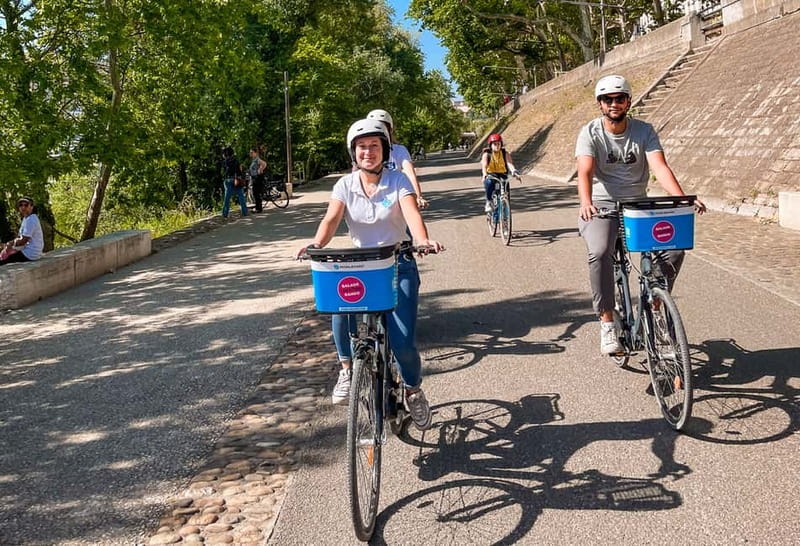 Lyon: Guided City Bike Tour - Place Bellecour and the Rhône banks: setting up the Confluence finale