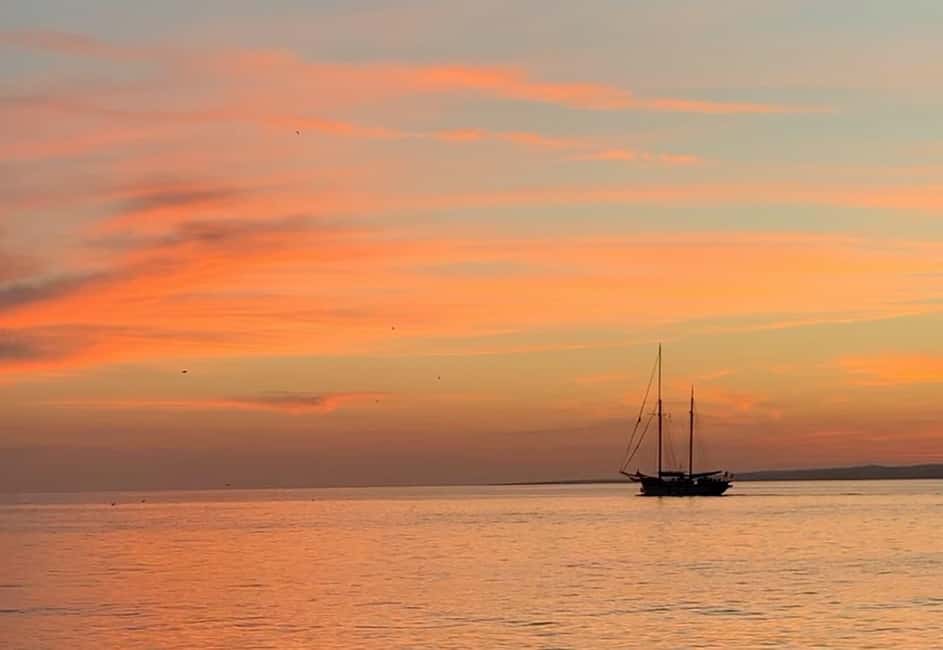 Marseille: Sunset Sailing Cruise with Dinner and Wine - Frioul archipelago cove stop: swim, snorkeling, and sunset timing