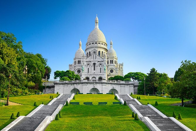 Montmartre District Walking Tour in Paris - Stop 1: Moulin Rouge backstory at the Montmartre border