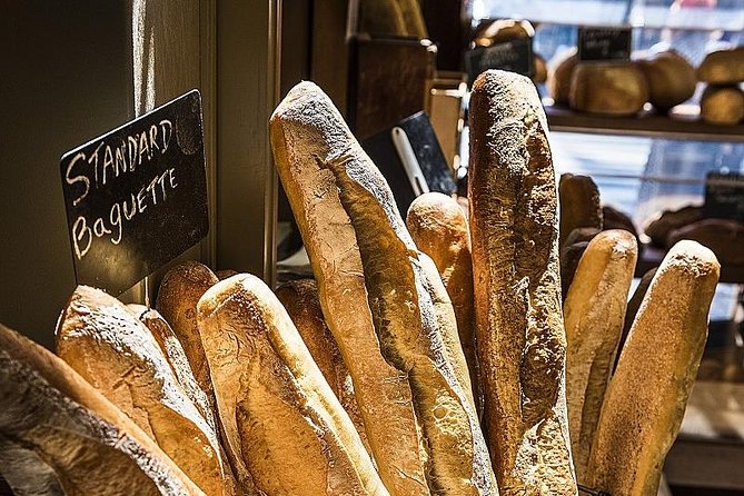 Montmartre Hidden Gems and Scenic Highlights Walking Tour - Stop 5: The man through a wall sculpture and a wink of surrealism