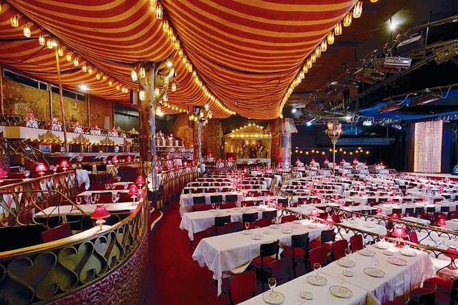 Moulin Rouge Dinner Show with Champagne and Drop Off - The Feerie revue: cancan on moving stairs and a giant aquarium