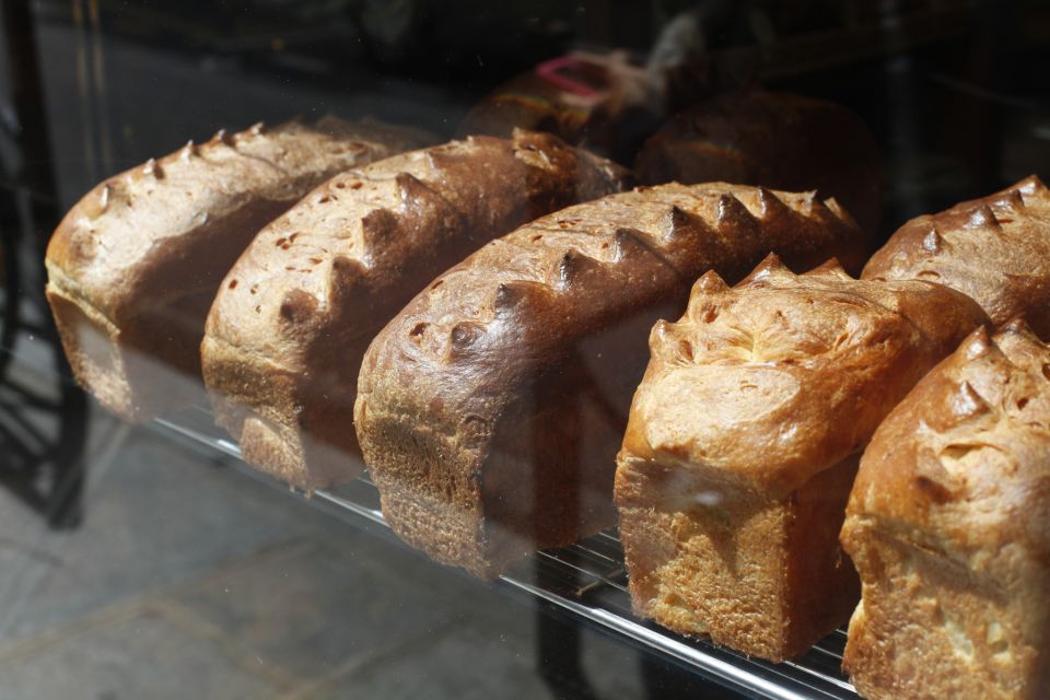 Paris: Behind the Scenes Bakery Tour with Breakfast - Breakfast first: croissants and pain au chocolat on a workday clock