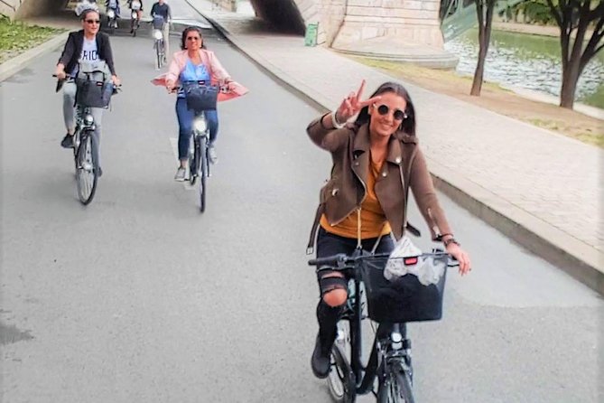 Paris: Charming Nooks and Crannies Bike Tour - Bastille Square, the prison legend, and riding beside the Seine
