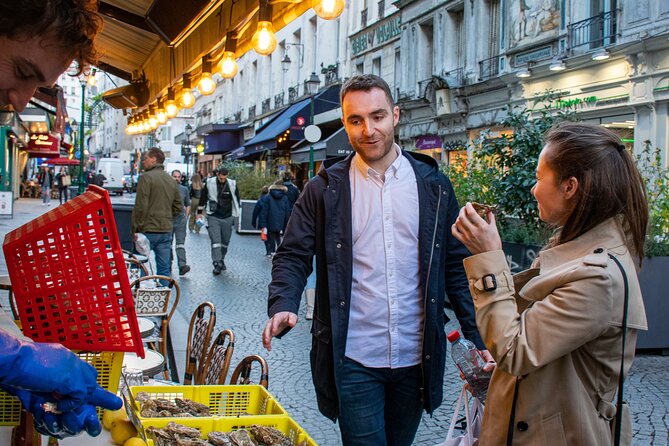 Paris Christmas Food Tour with a Local Guide, and Seasonal Treats - A seated café stop at Place Saint-André-des-Arts