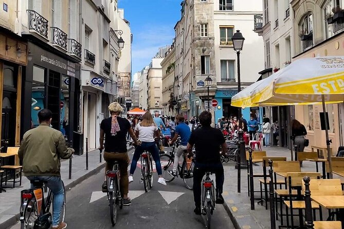 Paris: City Bike Tour on a Dutch Bike - Louvre exterior, Hôtel de Ville, and Notre-Dame from the bike lane