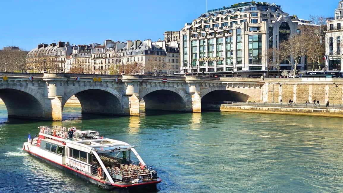 Paris: Cruise from The Canal Saint Martin to The Seine River - Sliding onto the Seine: Notre-Dame, the Louvre, and a very Paris view of the Eiffel Tower