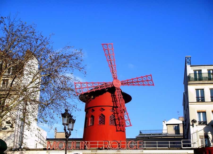 Paris: Montmartre Group Tour in German - Moulin Rouge stop: beyond the red lights photo
