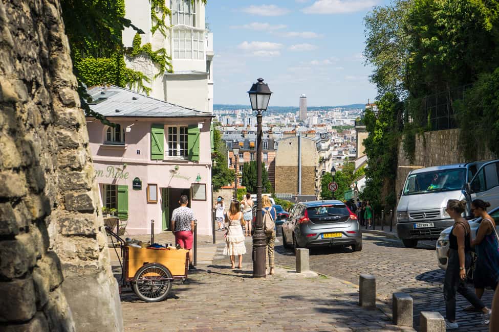 Paris: Montmartre Group Tour in German - Moulin de la Galette: windmills, then and now