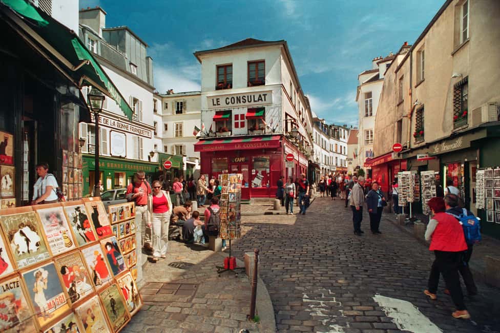 Paris: Montmartre Guided Walking Tour - Place Blanche meeting point and how the tour avoids the herd