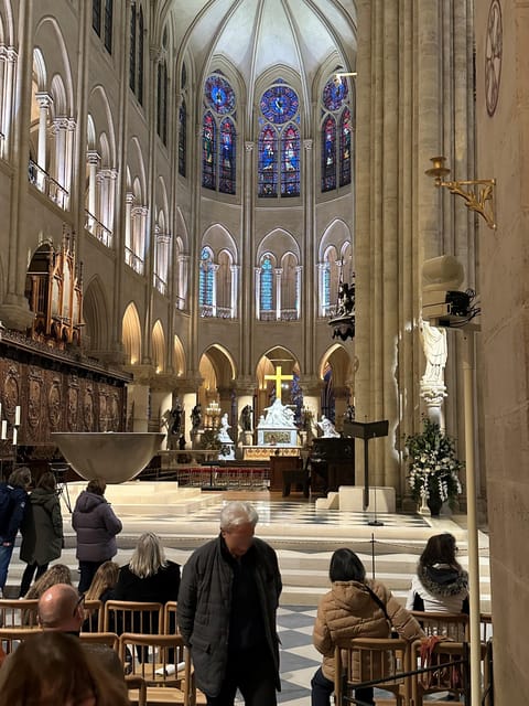Paris: Notre Dame Cathedral Guided Tour of the Neighborhood - Entering Notre-Dame: Free Entry, Optional Reservation, and Line Reality