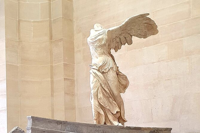 Paris Private Day Tour including Louvre Masterpieces Private Tour - A quick look at the Arc de Triomphe
