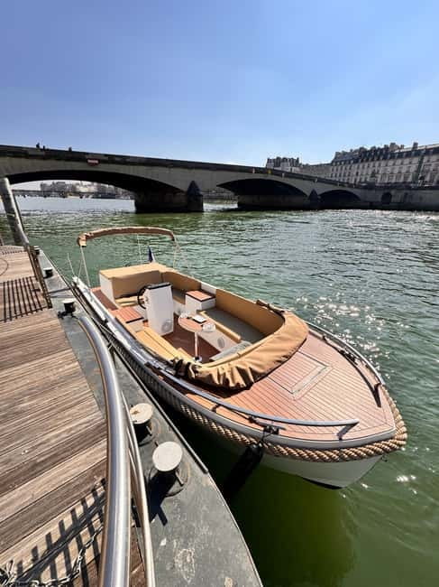 Paris: Private Small Boat Cruise with Rosé and Macarons - Passing the Louvre on the Way to Notre-Dame