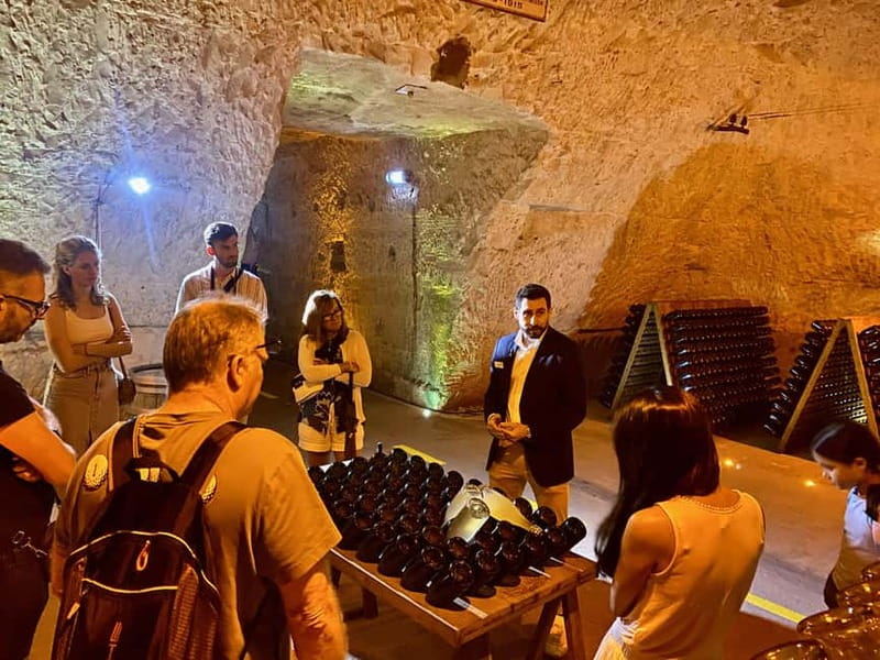 Paris: Ruinart and Veuve Clicquot Champagne Tour by Mercedes - Ruinart cellars and two glasses of Champagne