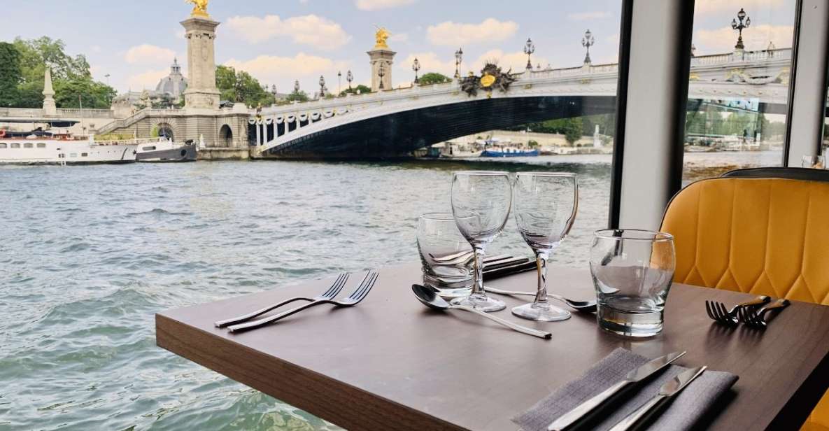 Paris: Seine River Bistronomic Dinner Cruise - The boat setup: outdoor terrace, indoor dining, and table service
