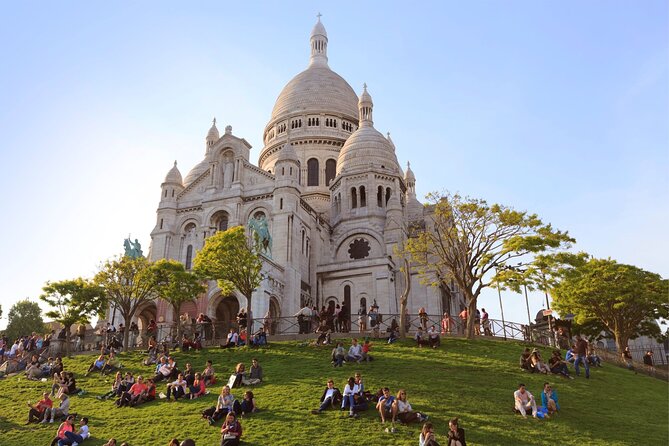 Paris: Small Group Moulin Rouge &Sacré Cœur Montmartre Tour - Place des Abbesses and the Saint Denis story: not just pretty churches