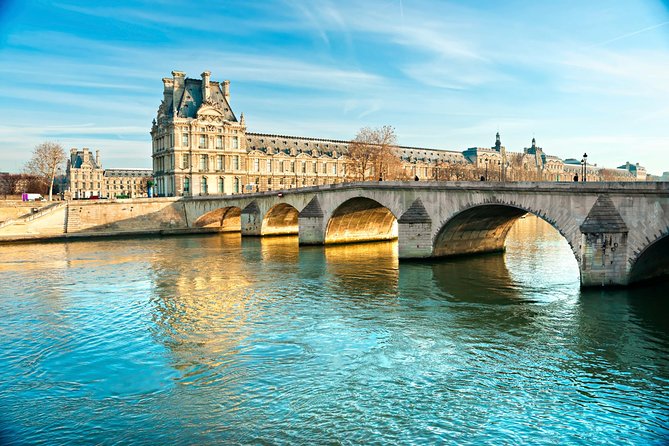 Paris Tour with Lunch at the Eiffel Tower and Seine River Cruise - The Eiffel Tower centerpiece: priority 1st-floor access and lunch at Madame Brasserie