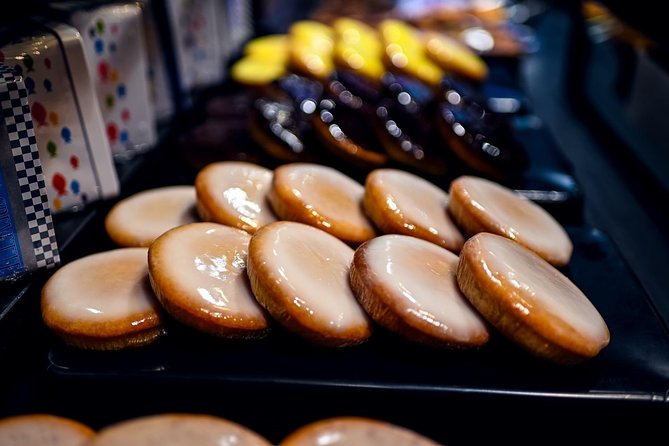 Private Montmartre Food Tour with Wine, Cheese & Pastries - The fabric district stop in the 18th arrondissement