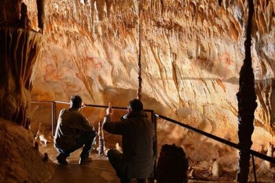 Sarlat : Private Tour to a Prehistoric Cave by Exploreo24 - Entering a narrow cave with only your group