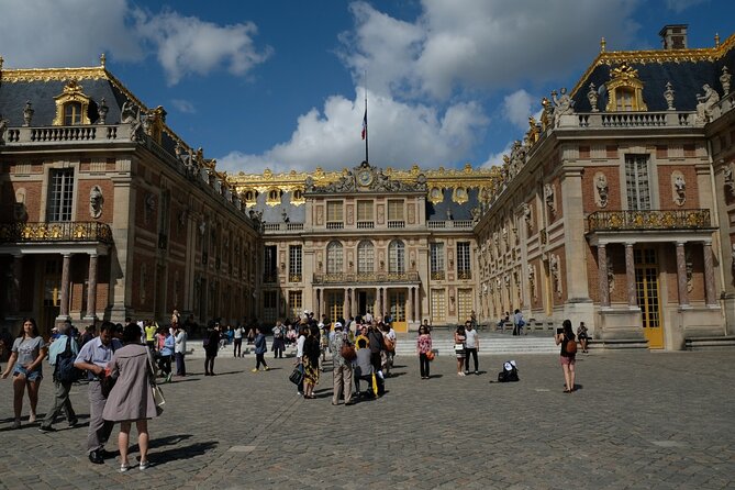Small Group Paris to Versailles Day Trip with Garden Stroll - Galerie des Carrosses: royal coaches in a tight window